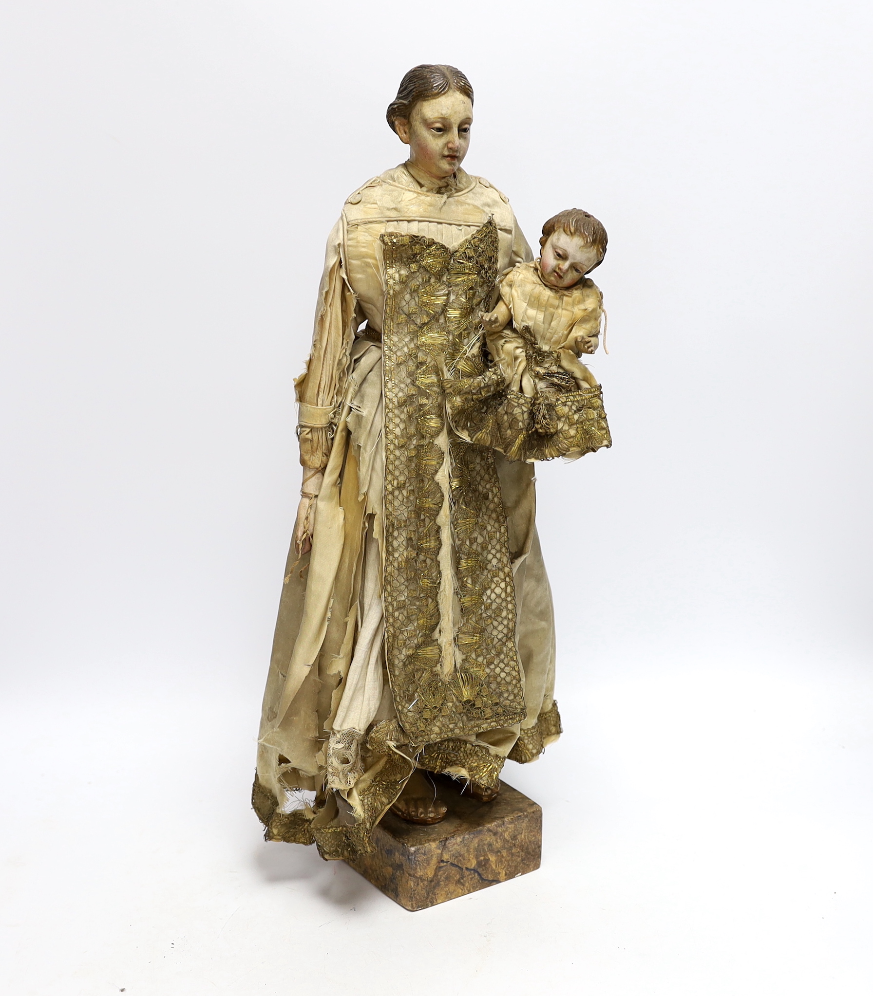 An 18th century Italian carved and painted wood model of Madonna and child, 45cm